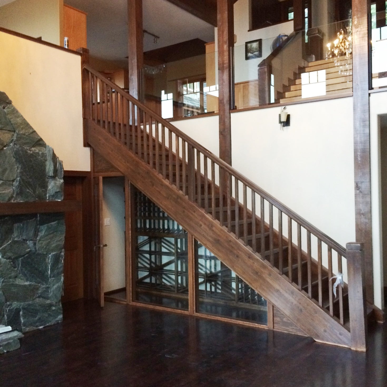 Custom Home Wine Cellar Under the Stairs with Knotty Alder Wine Racks