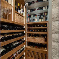 Have you ever seen wine bottles stored on the ceiling? This is one of the few modern wine cellars using this design approach!
